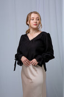 Romantic black blouse with ruffle sleeves