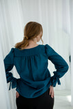 Romantic teal blouse with ruffle sleeves