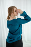 Romantic teal blouse with ruffle sleeves