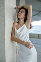 White midi silk slip dress with cowl neckline