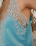 Silk satin camisole with lace details.